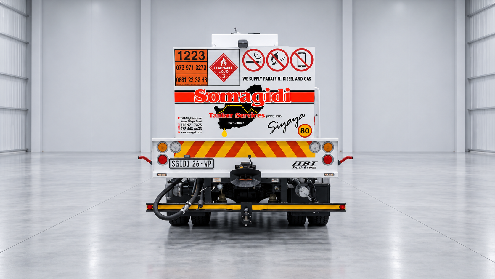 Full rear view of the Somagidi fuel tanker, with company branding and safety signage